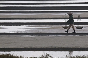 Asian Ethnicity Prints: Woman carrying salt on salt workings, Vietnam, Indochina, Southeast Asia, Asia