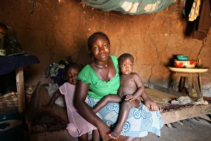 Benin Prints: Woman and children in an African hut, Tori, Benin, West Africa, Africa