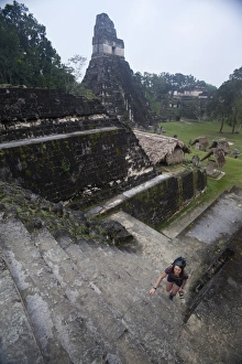 Caucasian Ethnicity Prints: Woman climbing stairs at Mayan archaeological site
