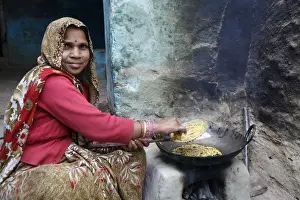 Headscarf Prints: Woman cooking, Mathura, Uttar Pradesh, India, Asia