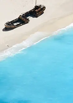 Shipwreck Prints: Woman drawing a heart on Zakynthos Beach near wrecked ship
