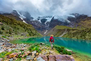Cusco Prints: Woman enjoying the cloudy view of Humantay Lake, Cusco, Peru, South America