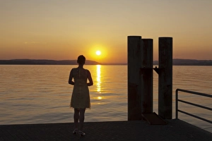 Unteruhldingen Prints: Woman enjoying the sunset, Unteruhldingen