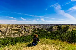 35 To 39 Years Prints: Woman enjoying the view along the Theodore Roosevelt National Park North Unit