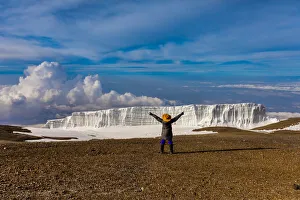35 39 Years Gallery: Woman enjoying the view on her way up Mount Kilimanjaro, UNESCO World Heritage Site, Tanzania