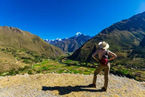 Woman exploring Inti Punku (Sun Gate), Cusco, Peru, South America