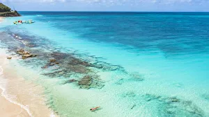 Mid Adults Prints: Woman floating in the crystal sea on idyllic tropical beach