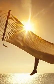 Bare Foot Prints: Woman in a hammock on the beach, Florida, United States of America, North America