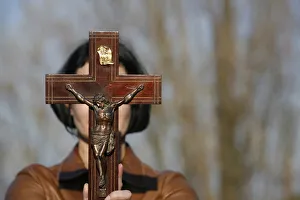 Crucifix Prints: Woman holding forth a crucifix, Isere, France, Europe