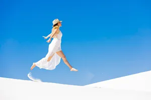 Dress Prints: Woman jumping on the Gypsum Sand Dune, White Sands, New Mexico, United States of America