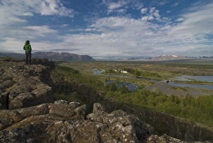 Images Dated 4th June 2009: Woman looking at the vast bare landscape of Pingvellir, where the American