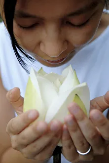 Images Dated 28th July 2007: Woman with lotus flower, Vietnam, Indochina, Southeast Asia, Asia