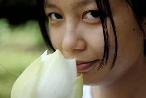 Images Dated 21st September 2009: Woman with lotus flower, Vietnam, Indochina, Southeast Asia, Asia