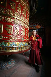 Prayer Wheel Prints: Woman and prayer wheel, Bodhnath Stupa, Kathmandu, Nepal, Asia