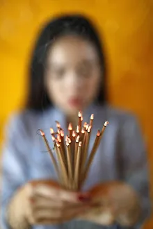 Hands Clasped Prints: Woman praying with incense sticks in hands, Thien Hung Buddhist temple