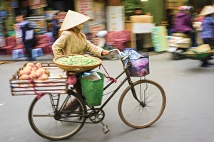 Pushing Prints: Woman pushing a bicycle in Old Quarter, Hoan Kiem District, Hanoi, Vietnam, Indochina