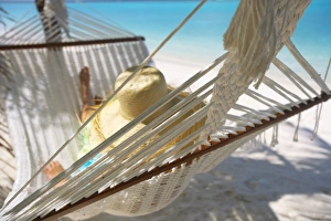 Relaxing Prints: Woman relaxing in a hammock, Maldives, Indian Ocean, Asia