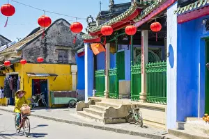 Hoi An Prints: Woman riding a bicycle past Trung Hoa Assembly Hall (Ngu Bang Assembly Hall), Hoi An