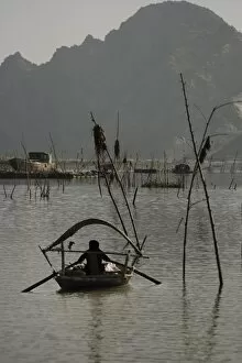 Woman rowing on Canal of Ken Ga, Ninh Binh, Vietnam, Indochina, Southeast Asia, Asia