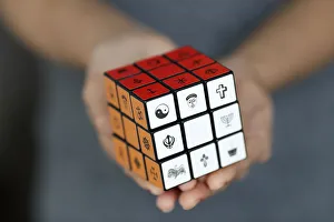 Human Hand Prints: Woman with a Rubiks cube with religious symbols, Interreligious