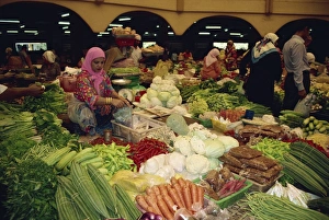 Covered Market Prints: Woman selling vegetables from her stall in the central