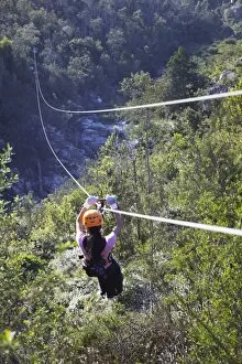 Images Dated 20th July 2010: Woman sliding down a zip-line, Storms River, Eastern Cape, South Africa, Africa