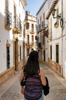 Mid Adults Prints: Woman in street of historic white village