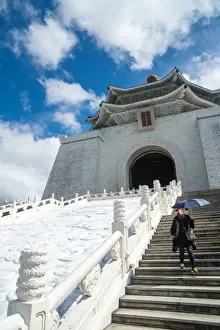 Taipei Prints: Woman with sun-shielding umbrella coming down the steps which lead up to the Chiang