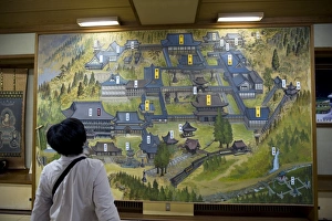 Images Dated 27th April 2009: Woman viewing map of Eiheiji Temple, headquarters of Soto sect of Zen Buddhism
