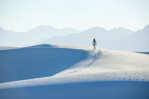 35 39 Years Gallery: A woman walking along a dunes ridge in White Sands National Park, New Mexico