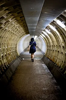 Light Beam Prints: Woman walking through the Greenwich foot tunnel