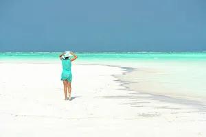 Dress Prints: Woman walking on idyllic empty beach, Zanzibar, Tanzania, East Africa, Africa