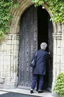 Images Dated 11th February 2000: Woman walking into Saint-Pierre de Solesmes Abbey church, Solesmes, Sarthe