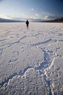 Salt Flat Prints: Woman walking on salt flats, Badwater Basin