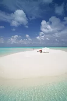 Woman walking on a sandbank, Maldives, Indian Ocean, Asia