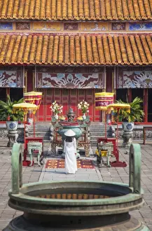 Woman wearing Ao Dai dress at Mieu Temple inside Citadel, Hue, Thua Thien-Hue, Vietnam, Indochina, Southeast Asia, Asia