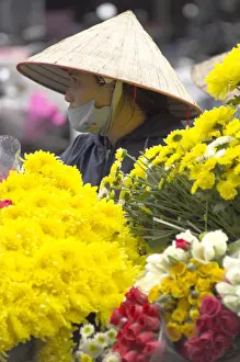 Head Piece Prints: Woman wearing traditional hat and selling fresh cut flowers