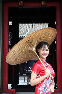 Parasol Prints: Woman wearing Vietnamese tradition dress called Ao Dai, Taoist temple