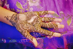 Paint Prints: Womans hand decorated with henna