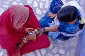 Images Dated 2nd August 2008: Womans hand being decorated with henna design