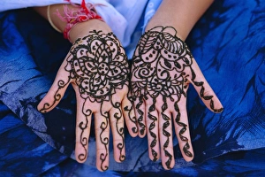Ethnic Prints: Womans hands decorated with henna