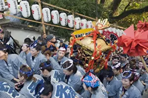 Shrines Prints: Women carrying a mikoshi portable shrine at Hadaka Matsuri (Naked Festival)