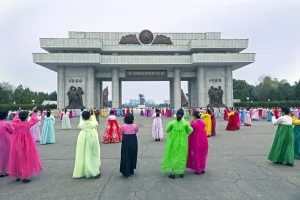 Typically Korean Prints: Women in colourful traditional dresses at mass dancing