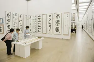 Art Galleries Prints: Women looking at calligraphy exhibition inside Kisho Kurokawa, 2007, National Art Centre