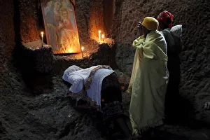 Worshipping Prints: Women praying in Bet Medhane Alem church in Lalibela, Wollo, Ethiopia, Africa