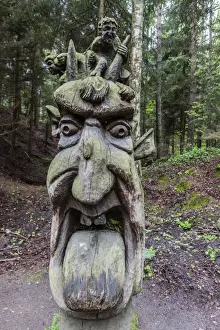 Lithuania Prints: Wood carvings from traditional folklore at The Hill of Witches on the Dano River at the northern tip of the Curonian