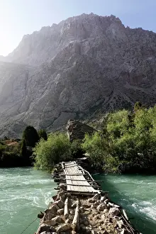 Wood Material Prints: Wooden bridge over a river in the remote and spectacular Fann Mountains