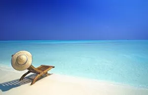 Images Dated 1st February 2010: Wooden deckchair and hat on tropical beach, Maldives, Indian Ocean, Asia