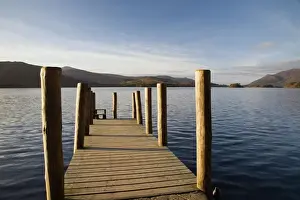 Wooden jetty at Barrow Bay landing on Derwent Water looking north west in autumn
