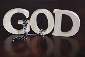 Rosary Prints: Wooden letters forming the word GOD and Rosary, Christian symbol, Vietnam, Indochina
